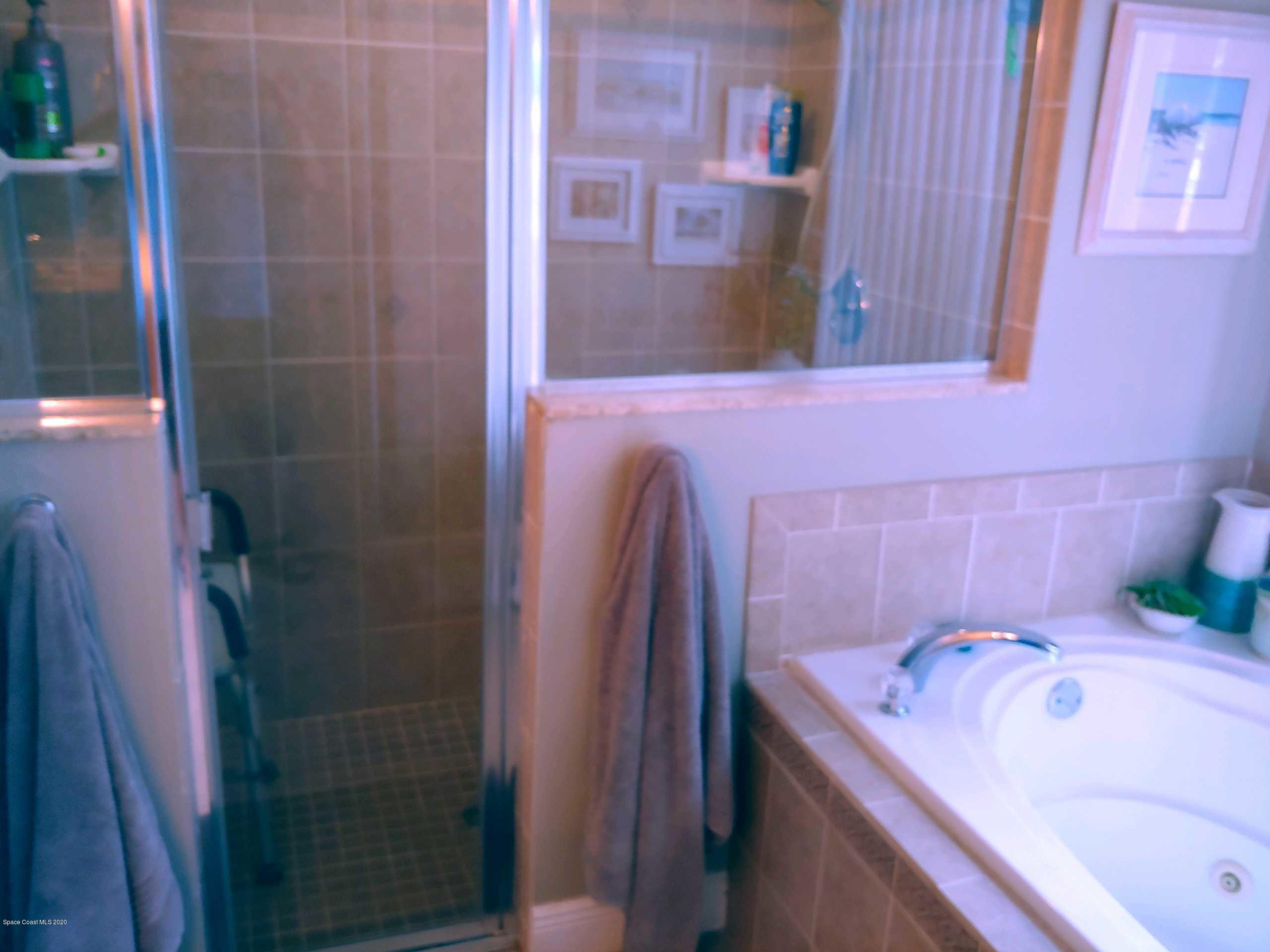 6791 Hartford Road Cocoa, FL 32927 - Photo 22 of 43 a bathroom with a tub and a sink