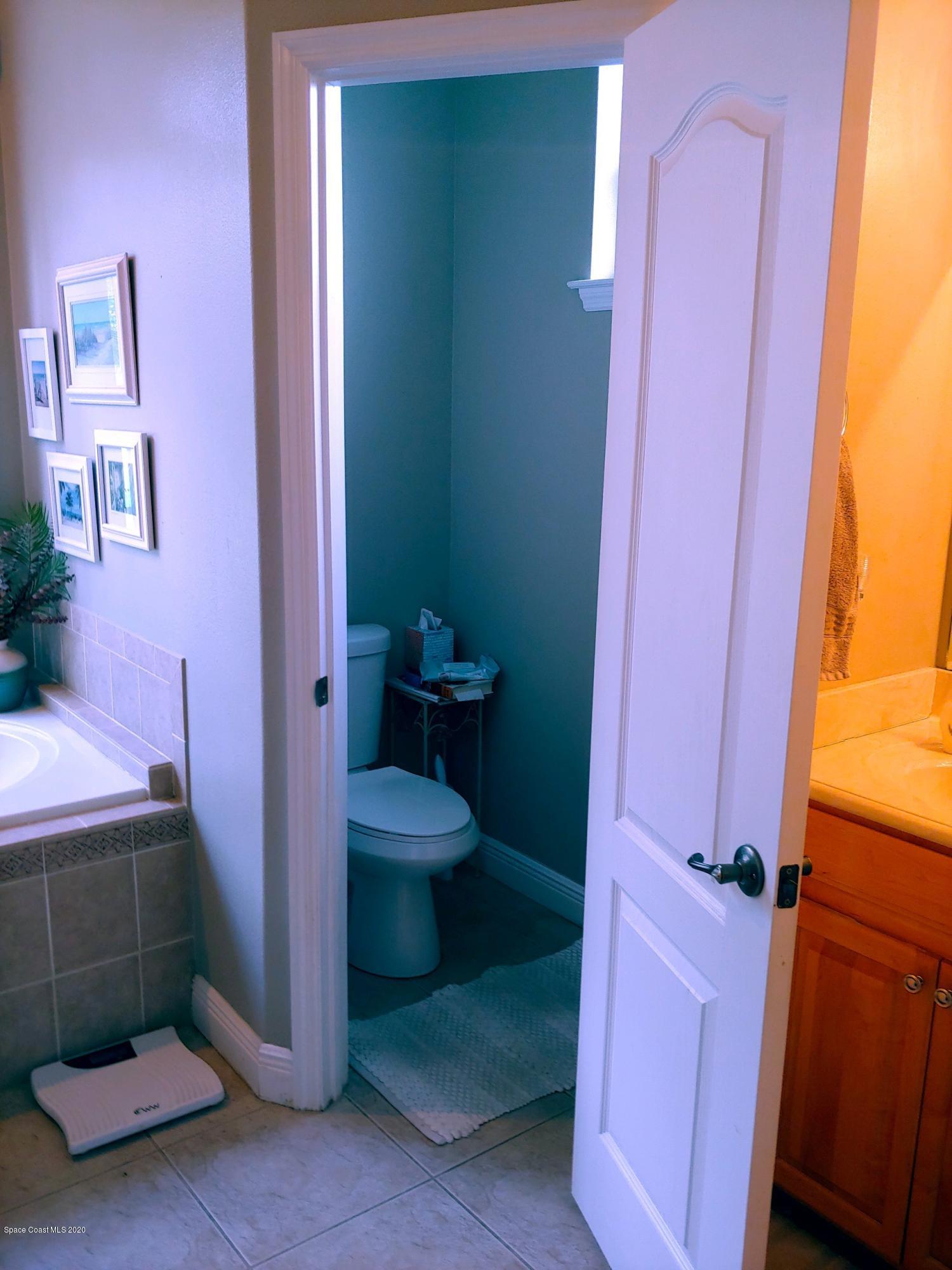 6791 Hartford Road Cocoa, FL 32927 - Photo 24 of 43 a bathroom with a toilet