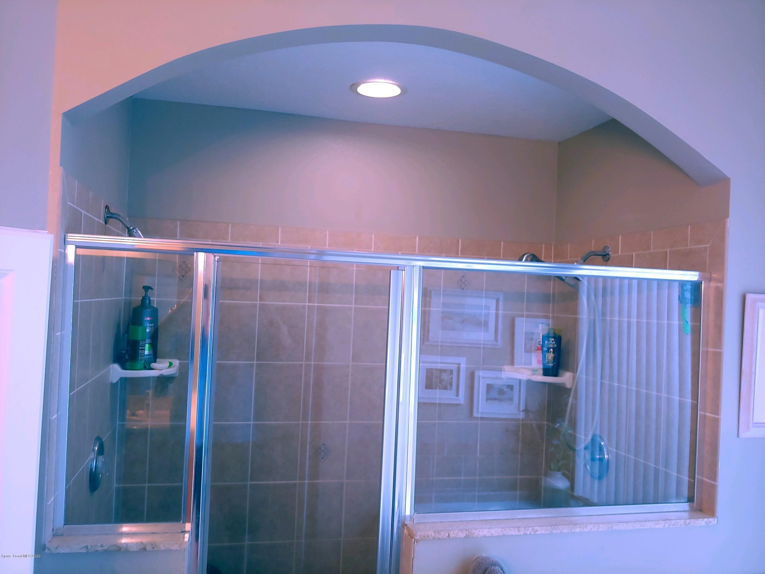 6791 Hartford Road Cocoa, FL 32927 - Photo 29 of 43 a bathroom with a shower