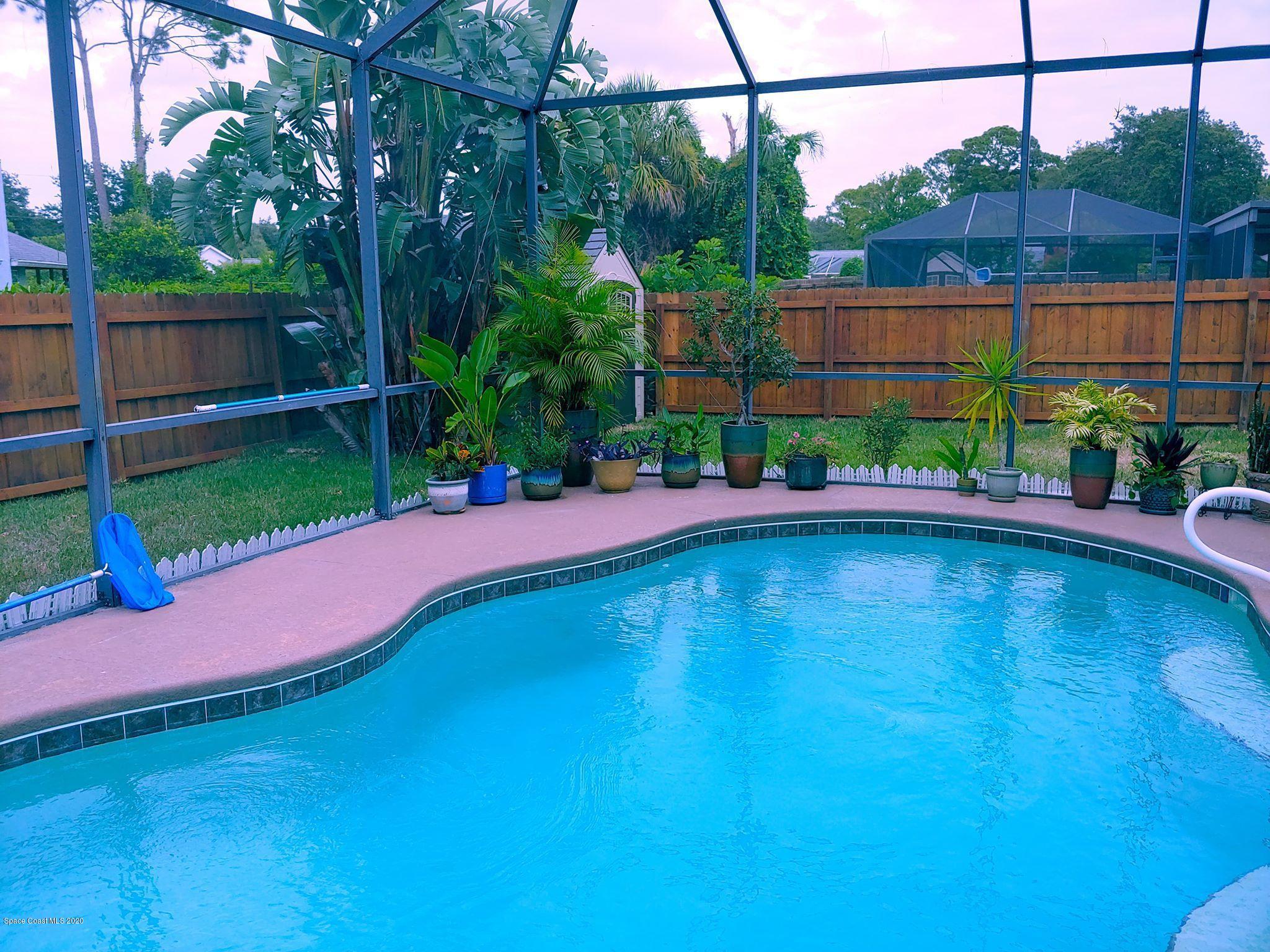 6791 Hartford Road Cocoa, FL 32927 - Photo 4 of 43 a view of a yard with a patio