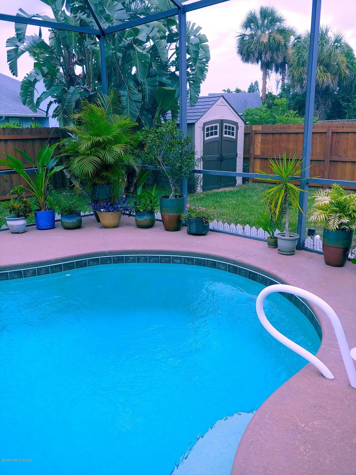 6791 Hartford Road Cocoa, FL 32927 - Photo 5 of 43 a view of a backyard with plants and a patio