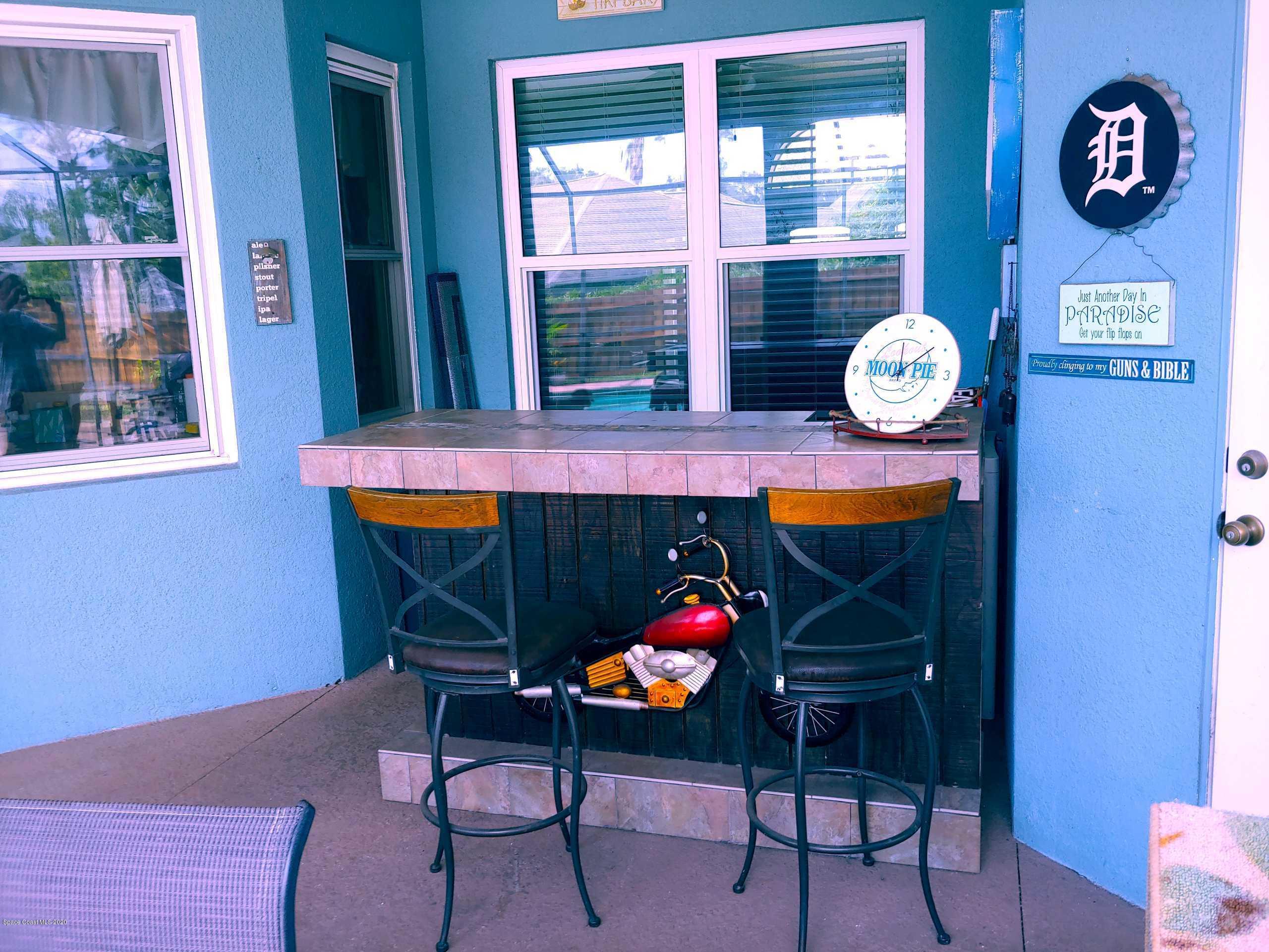 6791 Hartford Road Cocoa, FL 32927 - Photo 43 of 43 a view of a two chairs in a room