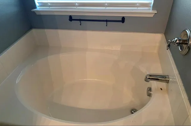 a view of a bathtub in a bathroom
