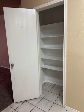 a bathroom with a sink and cabinets