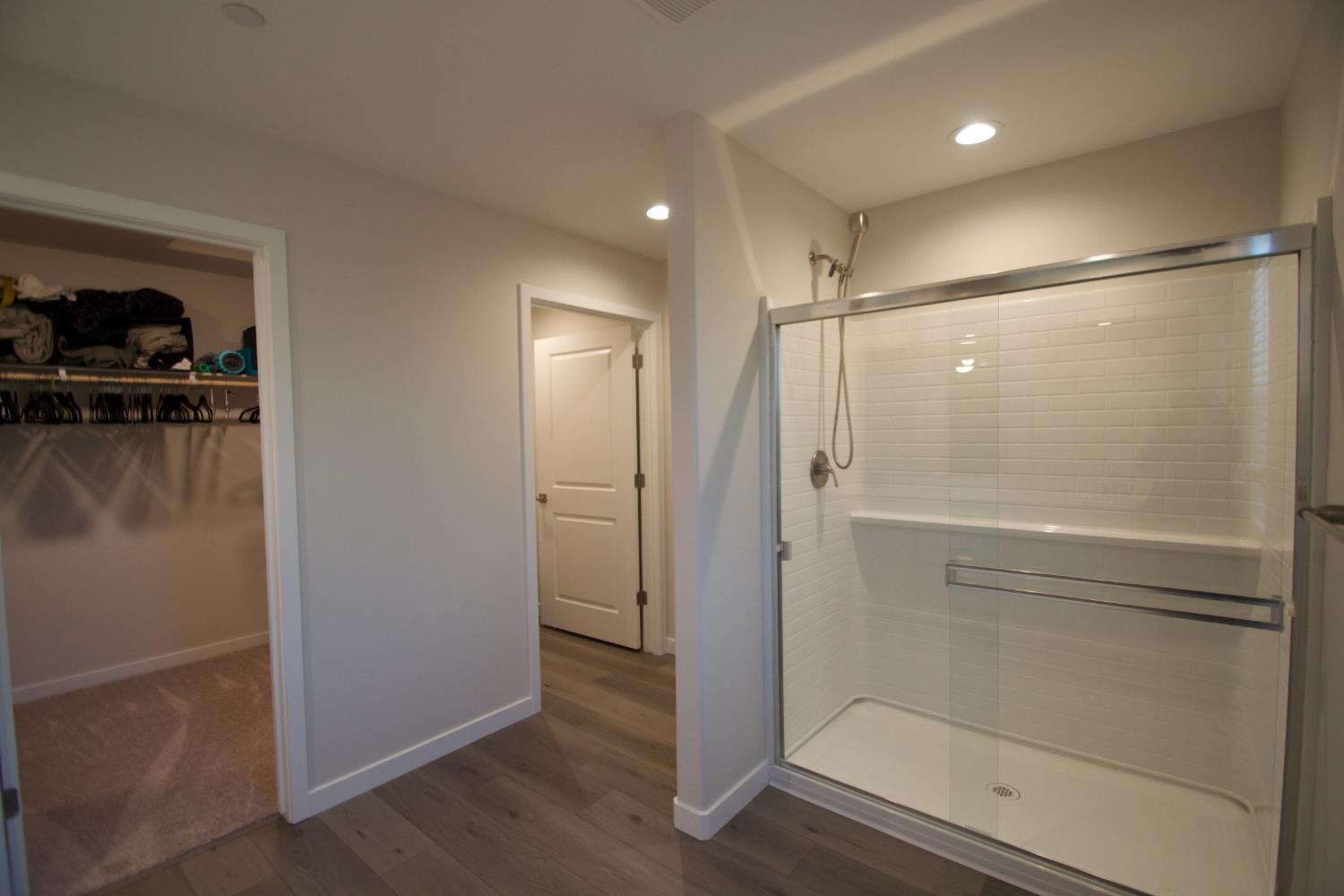 4154 Constance Road Madera, CA 93636 - Photo 12 of 23 a bathroom with a shower and a glass door