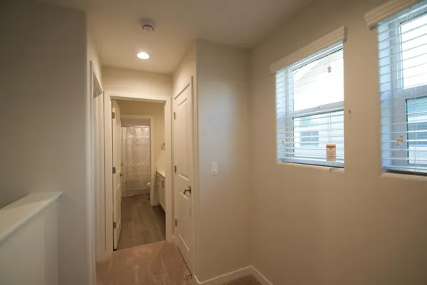 a bathroom with a glass shower door