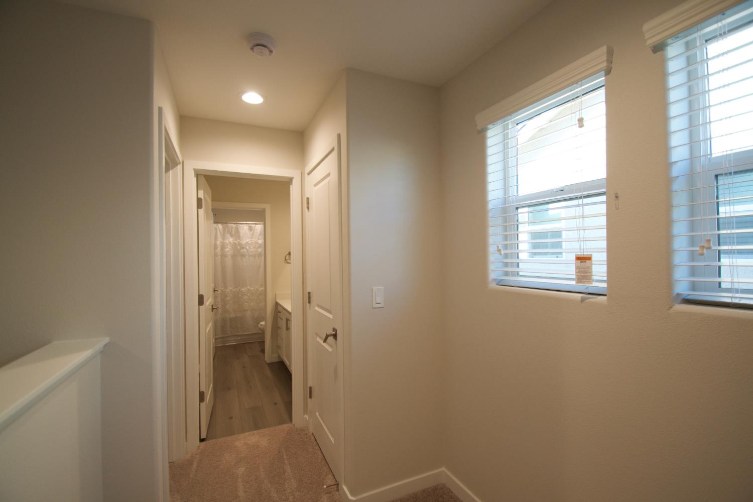 4154 Constance Road Madera, CA 93636 - Photo 15 of 23 a bathroom with a glass shower door
