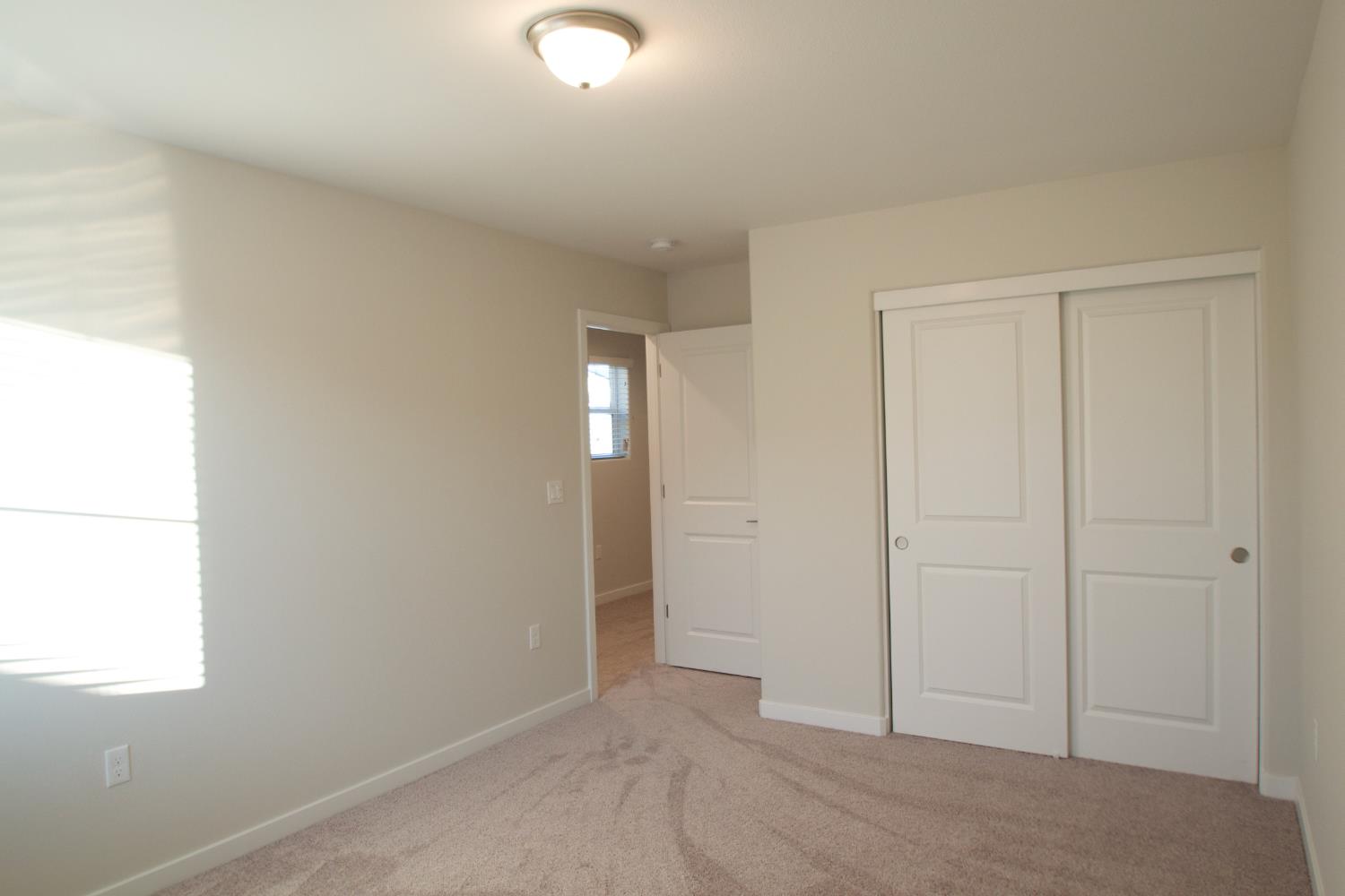4154 Constance Road Madera, CA 93636 - Photo 19 of 23 an empty room with windows