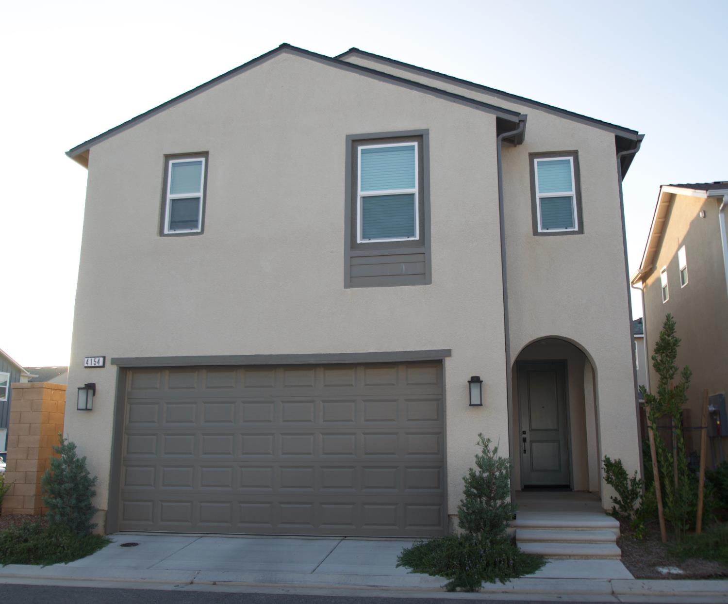 4154 Constance Road Madera, CA 93636 - Photo 2 of 23 a front view of a house with plants