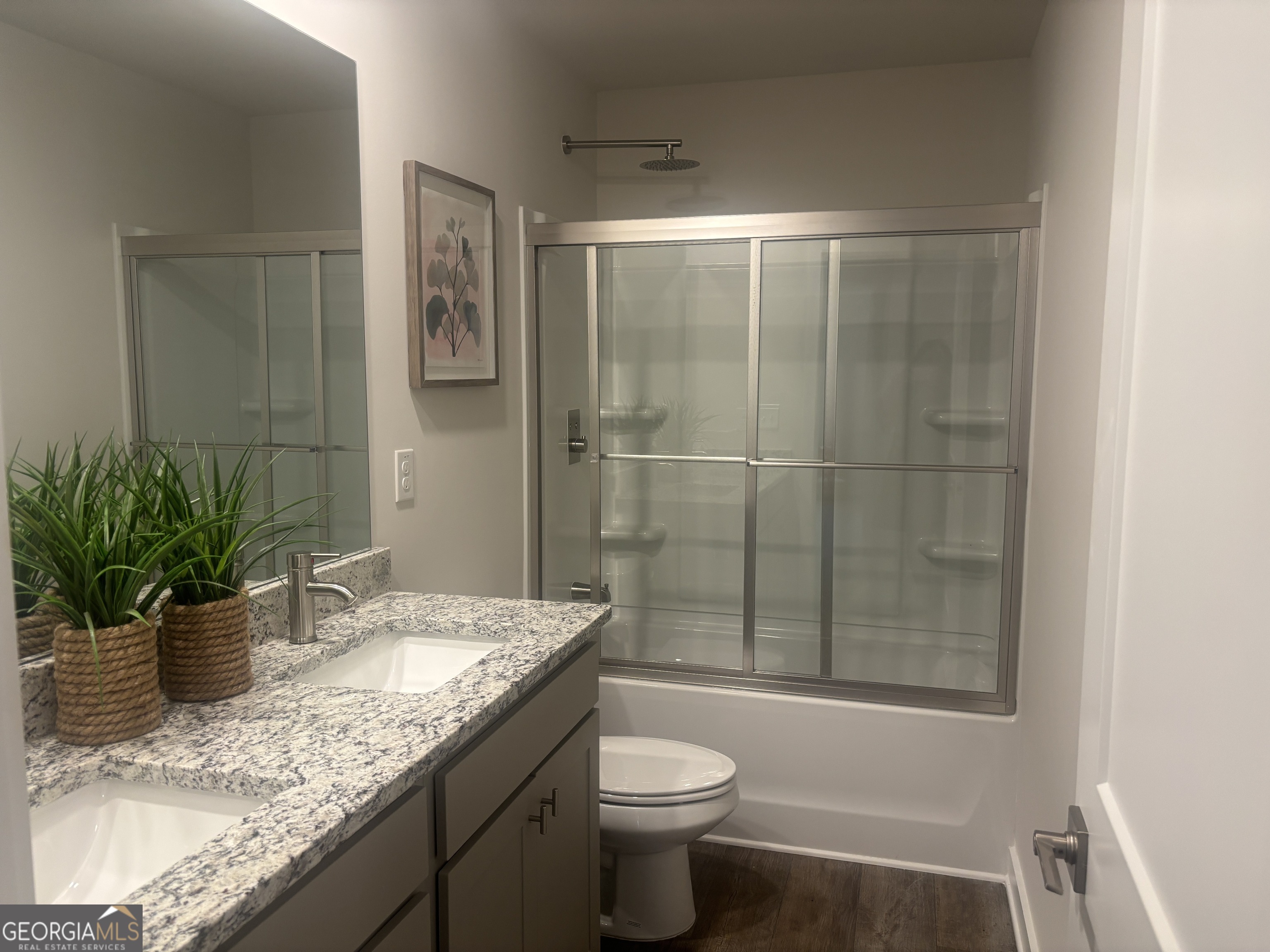 5355 Tolar Road South Fulton, GA 30213 - Photo 20 of 37 a bathroom with a granite countertop sink a toilet and shower
