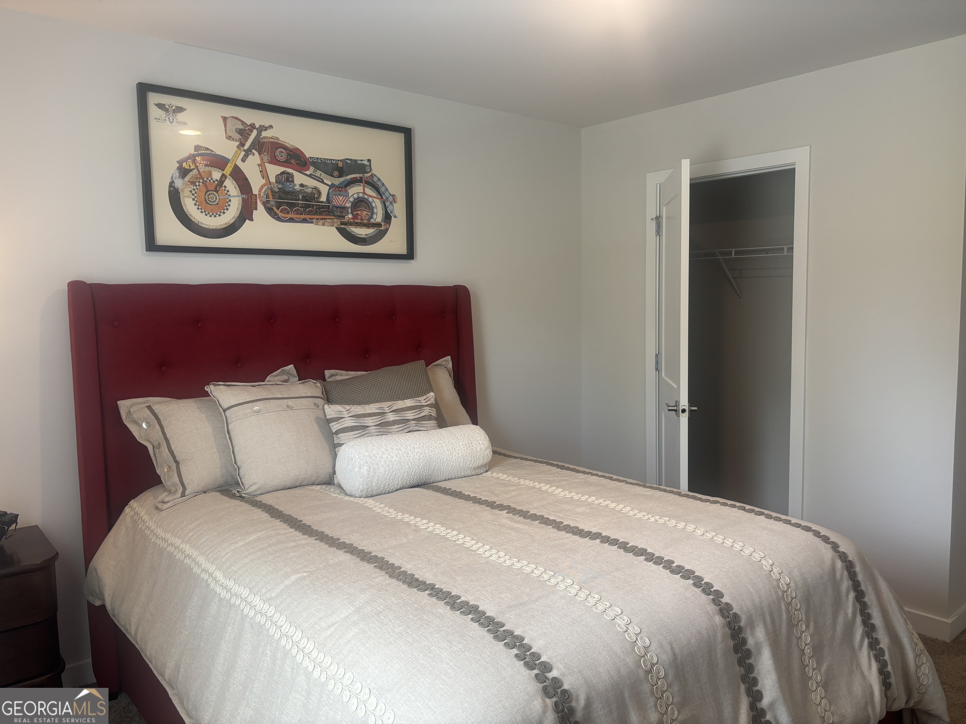 5355 Tolar Road South Fulton, GA 30213 - Photo 31 of 37 a bedroom with a large bed and paintings on the wall