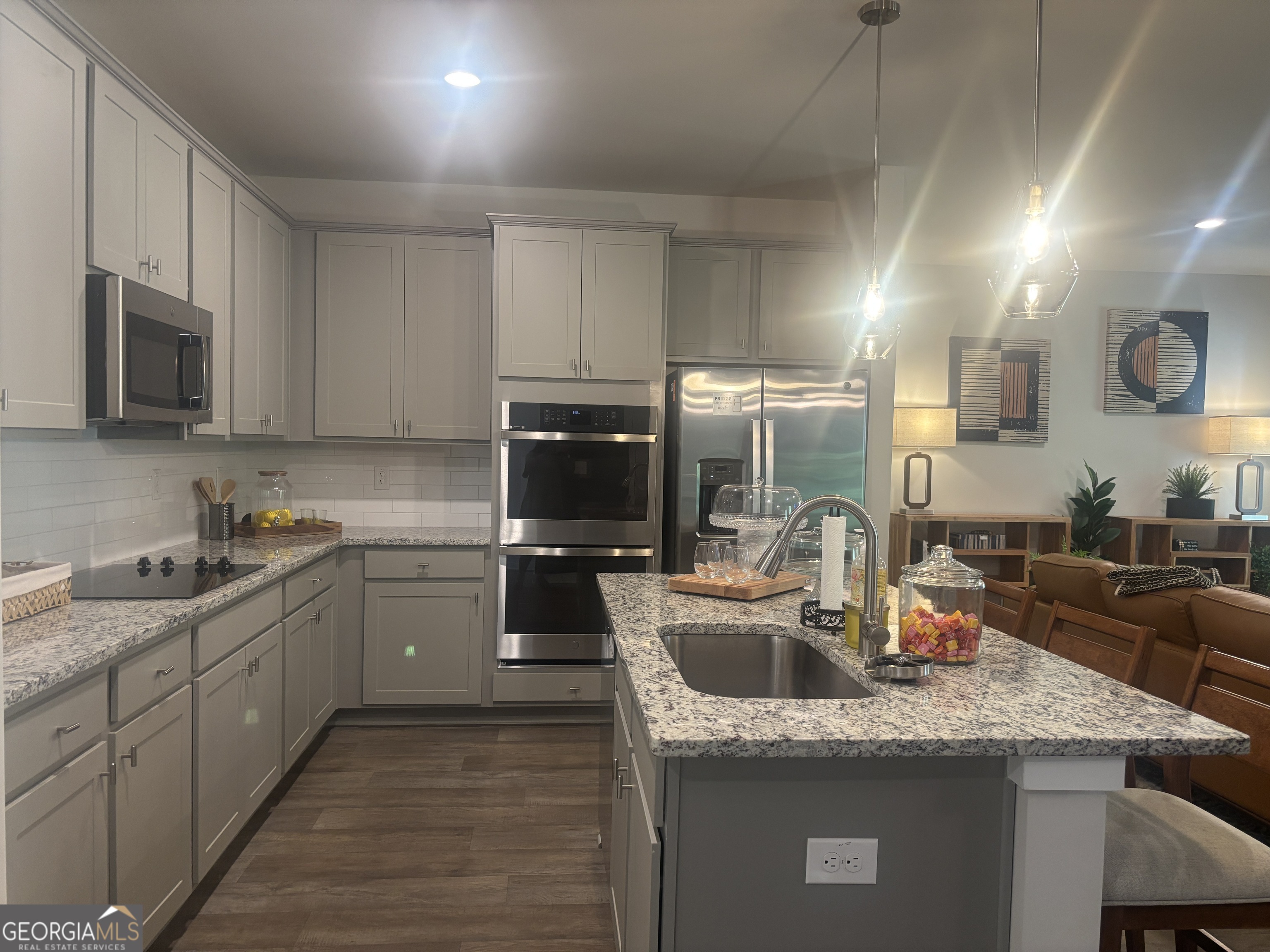 5355 Tolar Road South Fulton, GA 30213 - Photo 5 of 37 a kitchen with stainless steel appliances granite countertop a sink a stove and a microwave