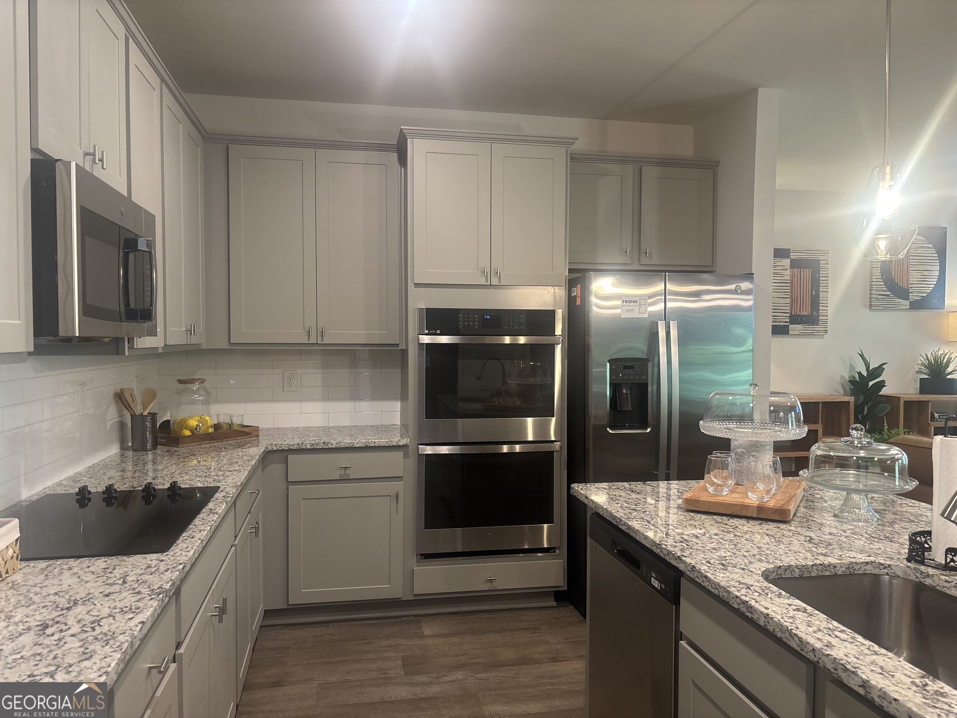 5355 Tolar Road South Fulton, GA 30213 - Photo 6 of 37 a kitchen with a sink stove and cabinets