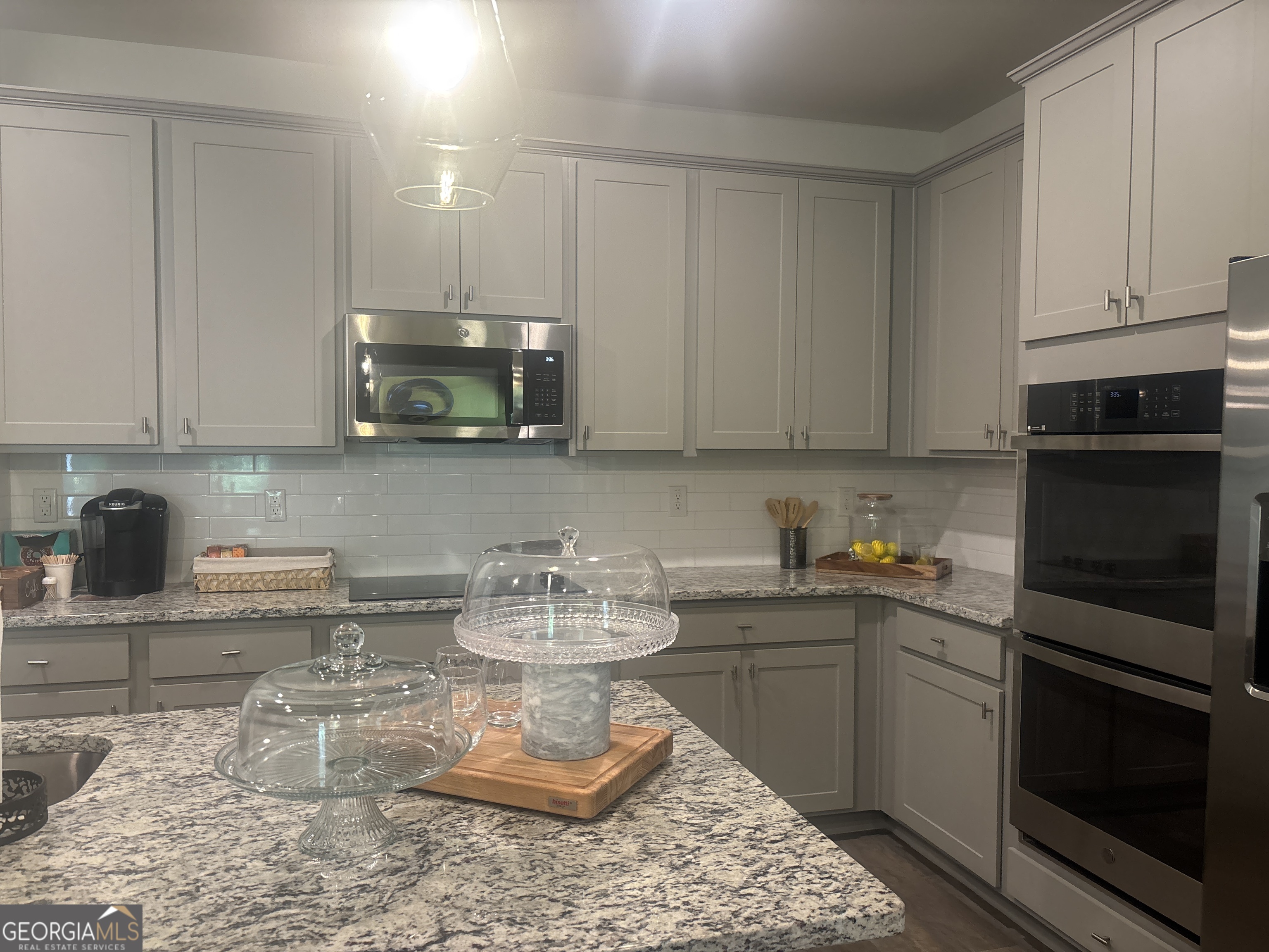5355 Tolar Road South Fulton, GA 30213 - Photo 8 of 37 a kitchen with a stove a sink and cabinets