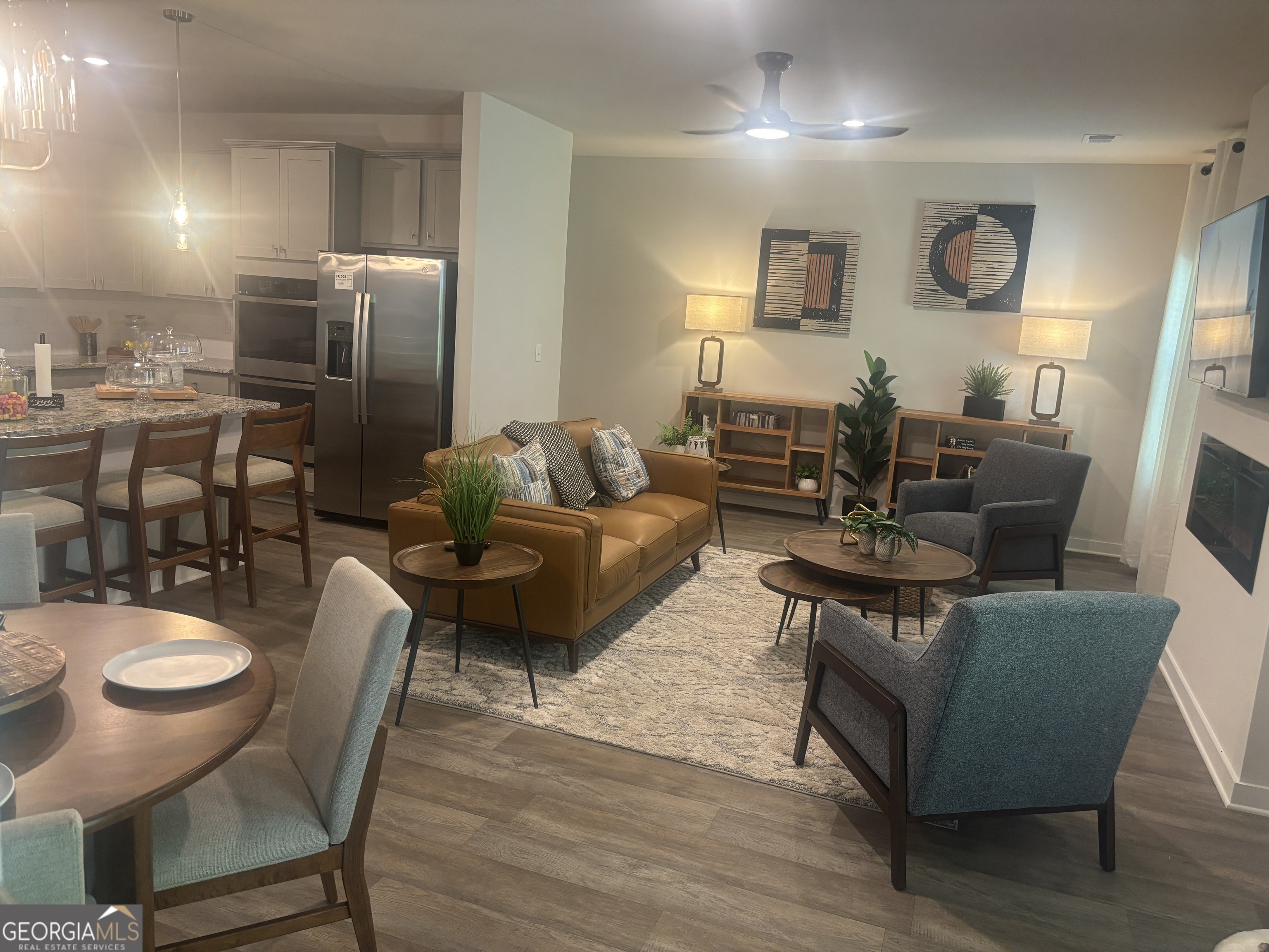 5355 Tolar Road South Fulton, GA 30213 - Photo 10 of 37 a living room with furniture dining table and wooden floor