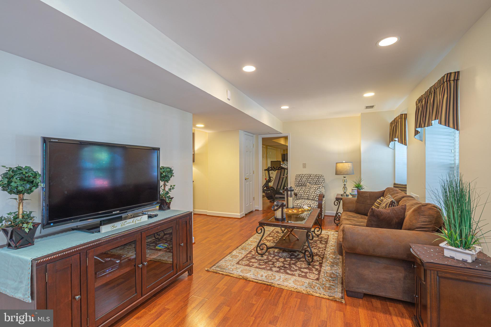 10810 Avonlea Ridge Place Damascus, MD 20872 - Photo 25 of 36 Lower level family room with exercise room.