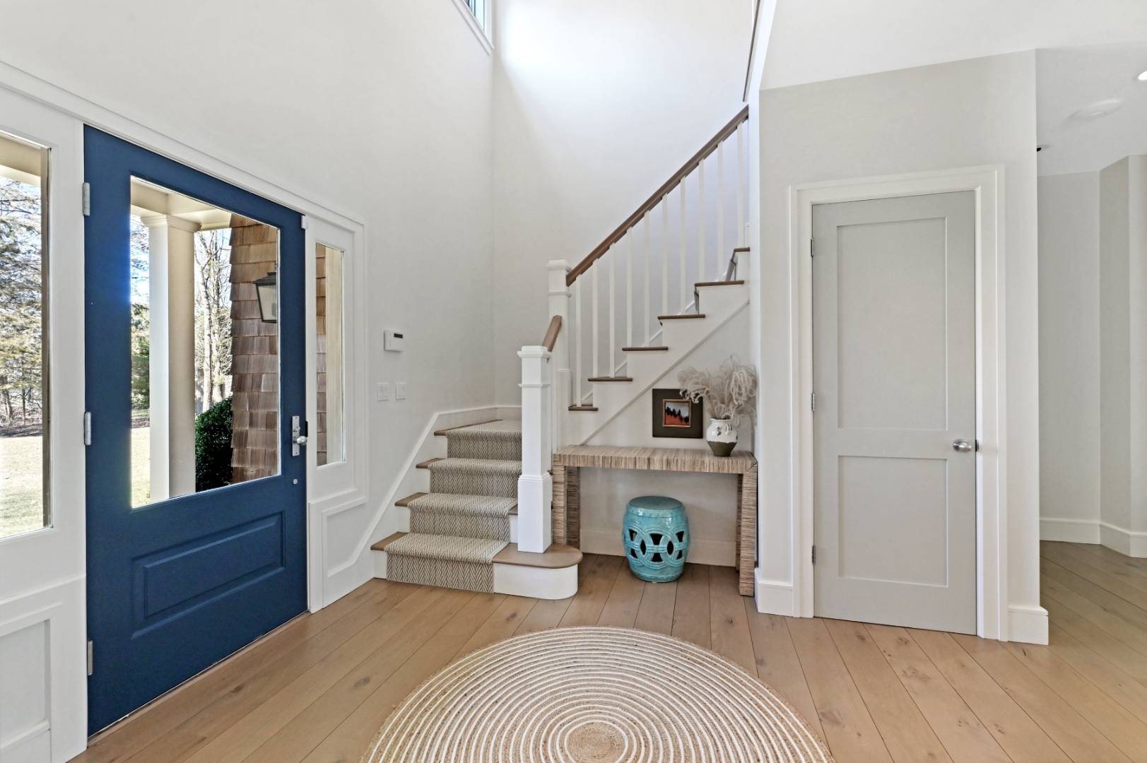 60 Jagger Lane Westhampton, NY 11977 - Photo 3 of 35 a room with stairs and a wooden floor