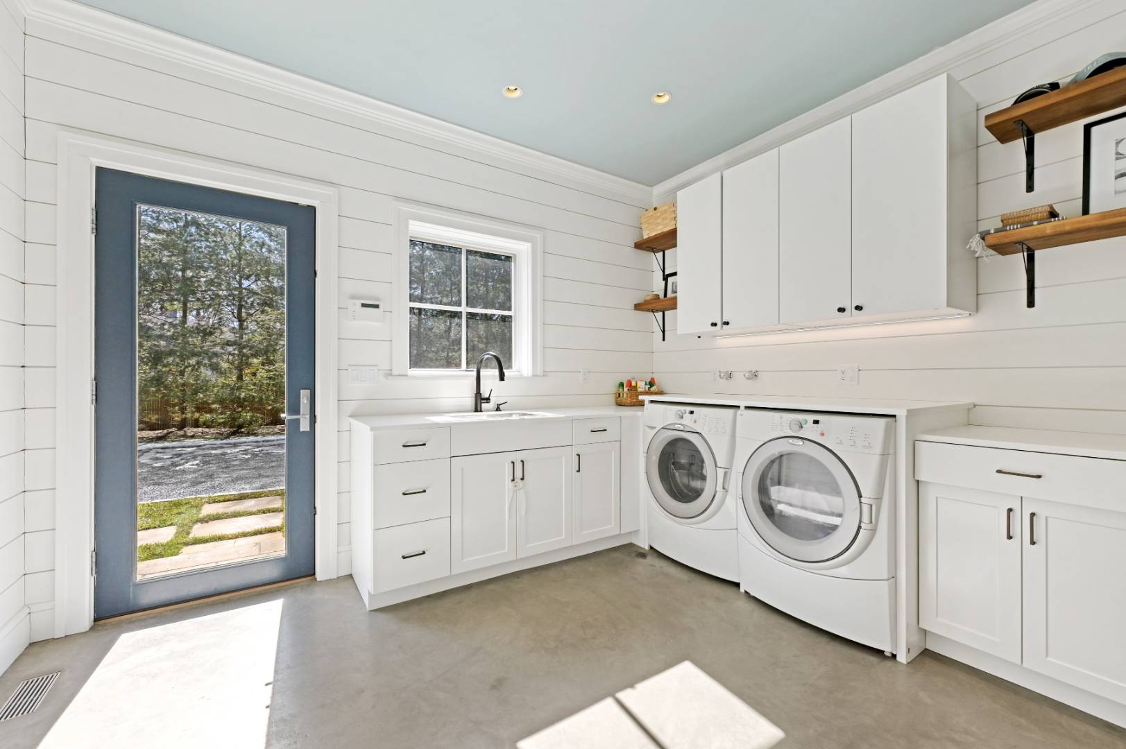 60 Jagger Lane Westhampton, NY 11977 - Photo 27 of 35 a utility room with cabinets washer and dryer
