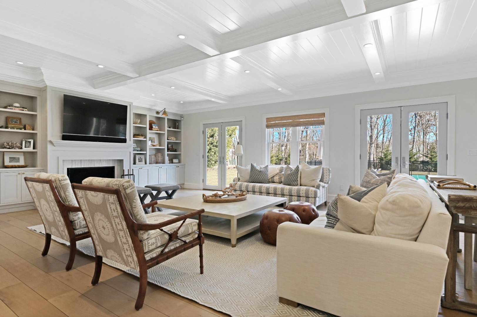60 Jagger Lane Westhampton, NY 11977 - Photo 4 of 35 a living room with fireplace furniture and a flat screen tv