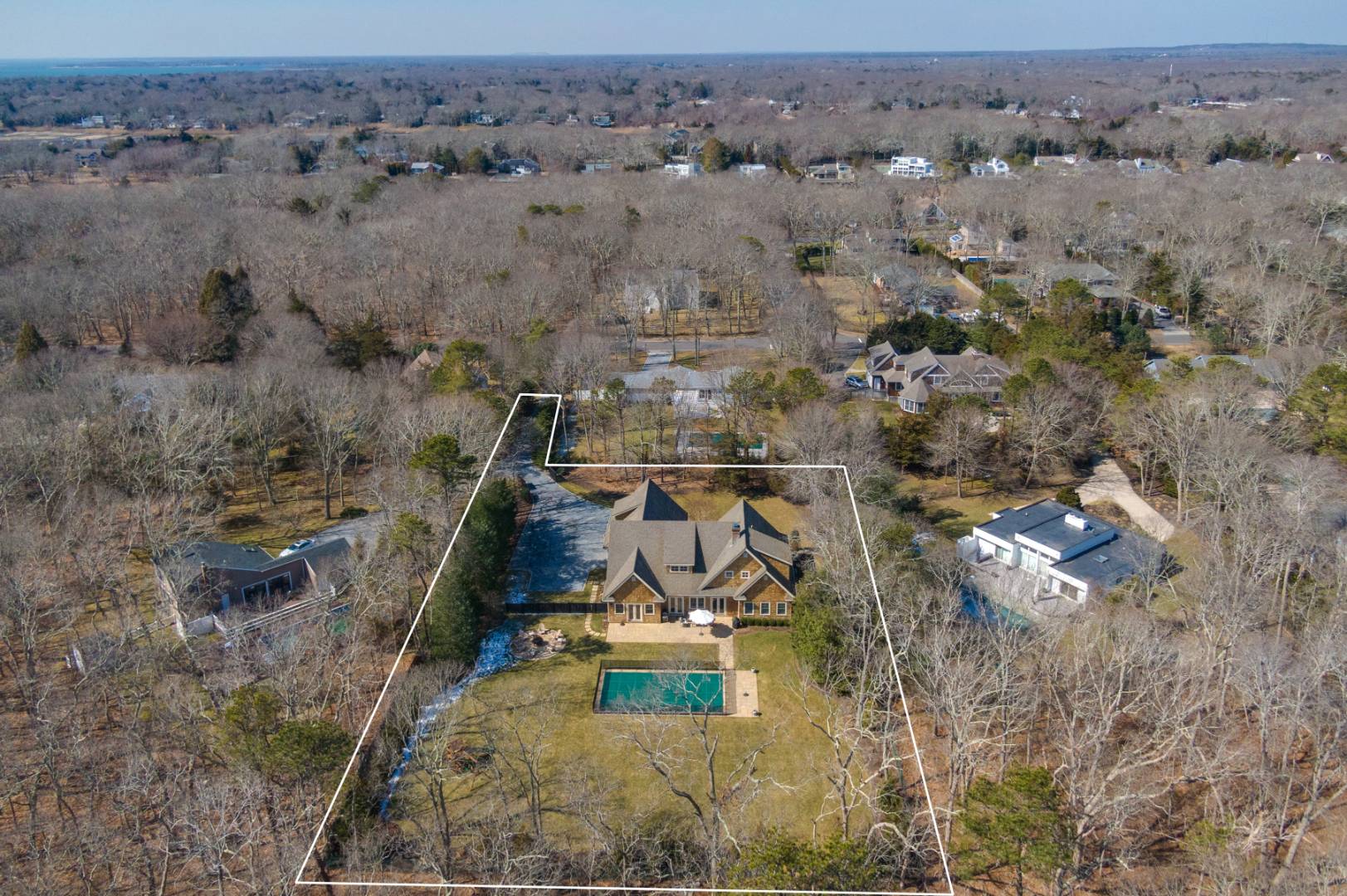 60 Jagger Lane Westhampton, NY 11977 - Photo 33 of 35 an aerial view of a house with a swimming pool