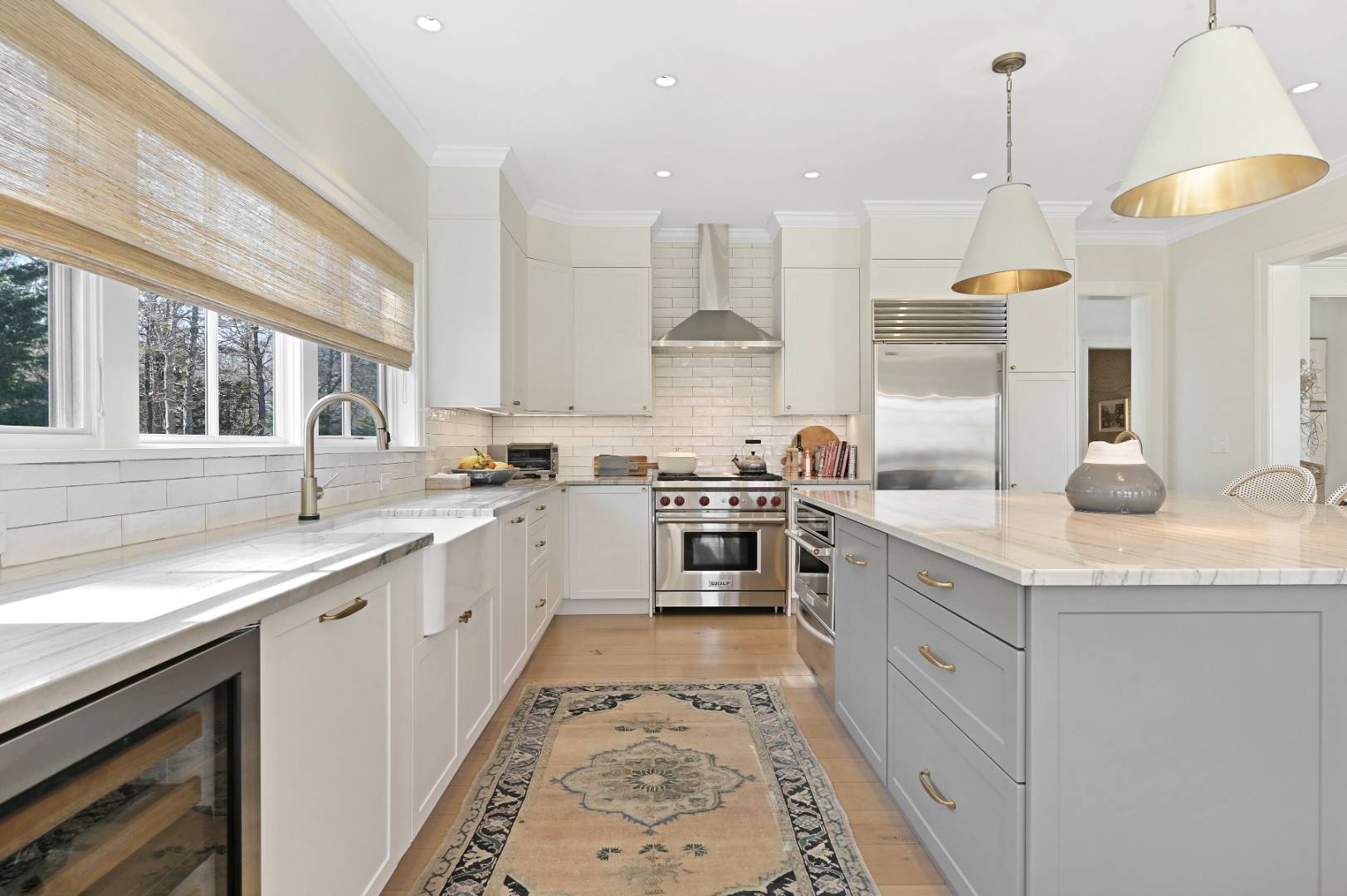 60 Jagger Lane Westhampton, NY 11977 - Photo 8 of 35 a kitchen with a sink stove and cabinets