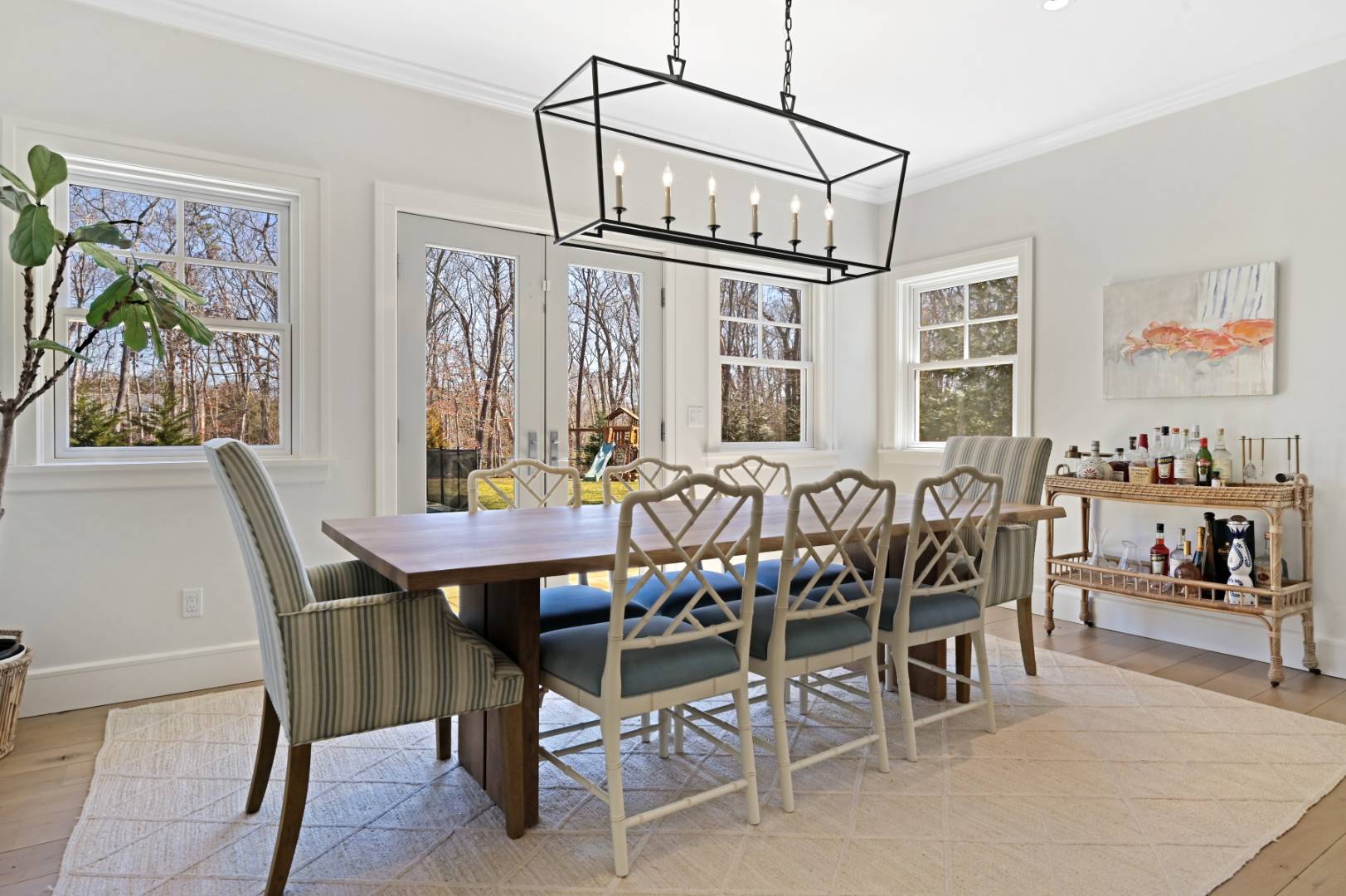 60 Jagger Lane Westhampton, NY 11977 - Photo 10 of 35 a view of a dining room with furniture one side kitchen view and wooden floor