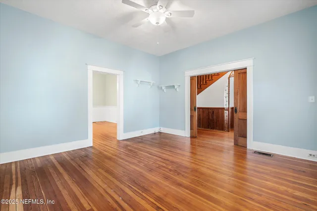 a kitchen with granite countertop white cabinets and window