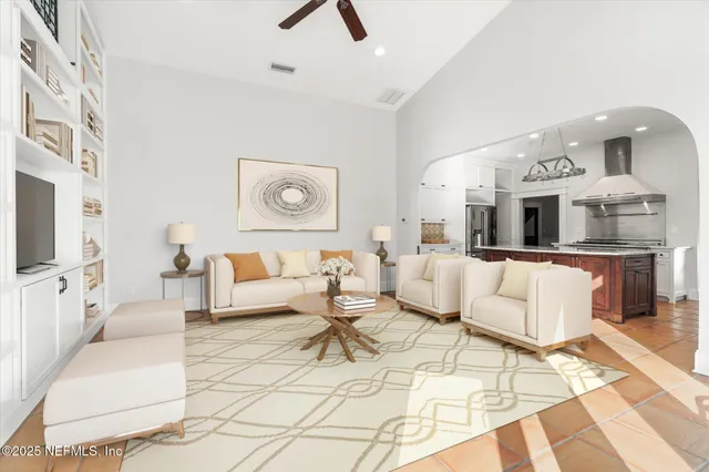 a view of a hallway with wooden floor and stairs