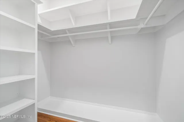 a view of a swimming pool with chairs