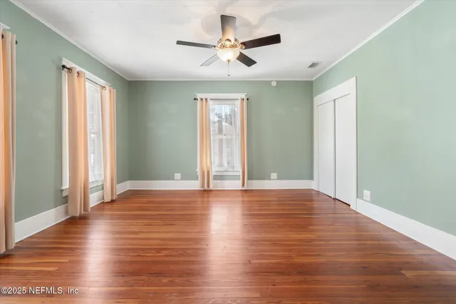 an aerial view of a house with a big yard