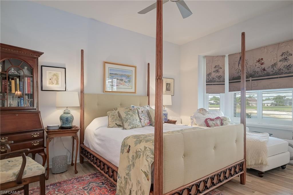 21533 Portrush Run Estero, FL 33928 - Photo 20 of 37 a living room with a bed furniture and a window