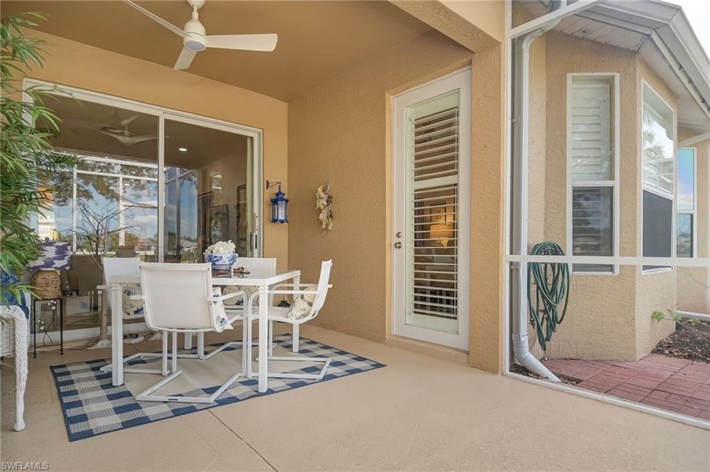 21533 Portrush Run Estero, FL 33928 - Photo 28 of 37 a view of a dining room with furniture and window
