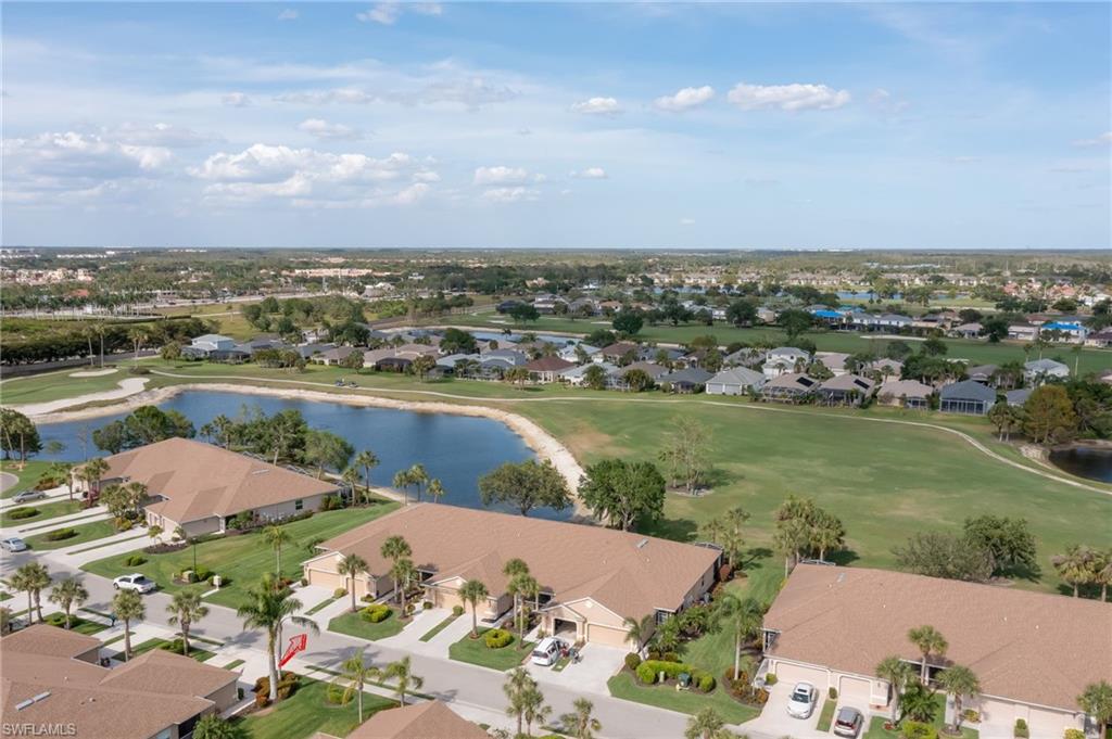21533 Portrush Run Estero, FL 33928 - Photo 30 of 37 an aerial view of a house with a lake view