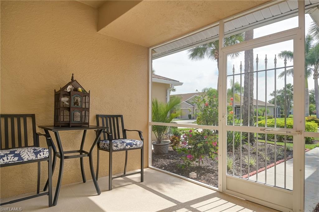 21533 Portrush Run Estero, FL 33928 - Photo 5 of 37 a view of a balcony with chairs