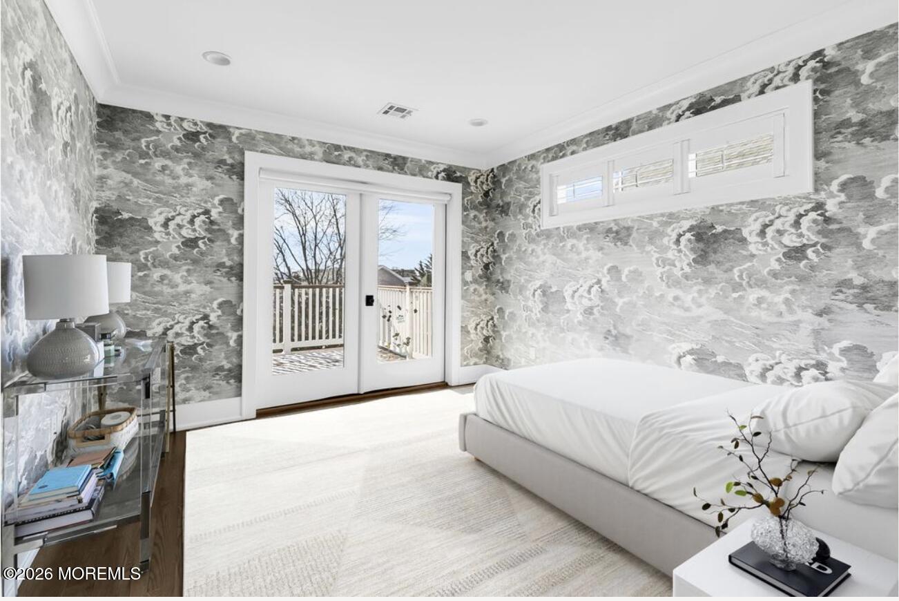 39 Washington Avenue Rumson, NJ 07760 - Photo 14 of 21 a spacious bedroom with a bed and glass door