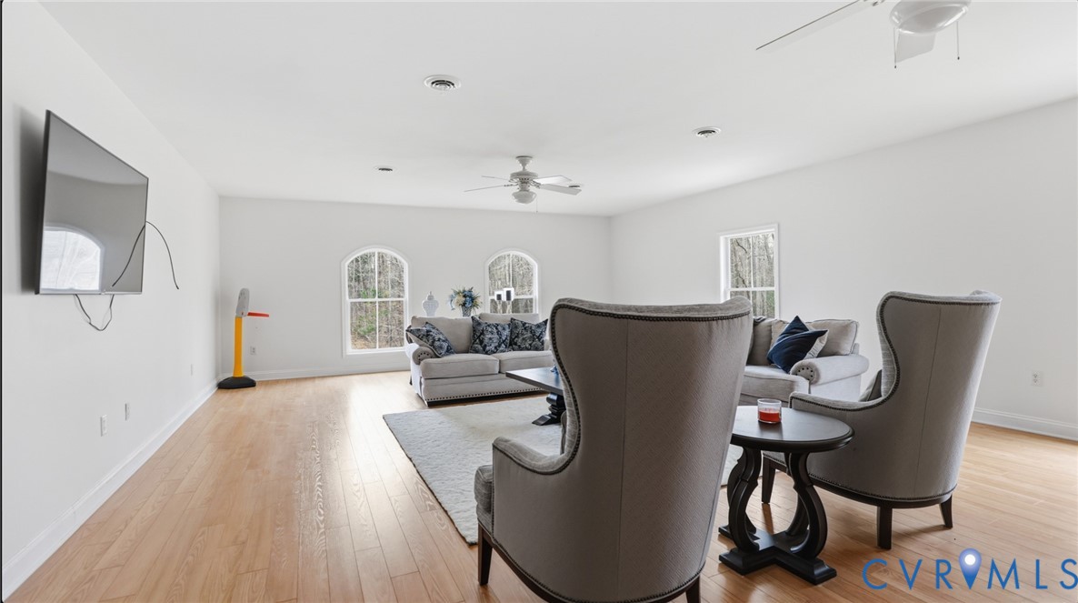 4510 Bell Road Powhatan, VA 23139 - Photo 6 of 12 a living room with furniture a rug and white walls
