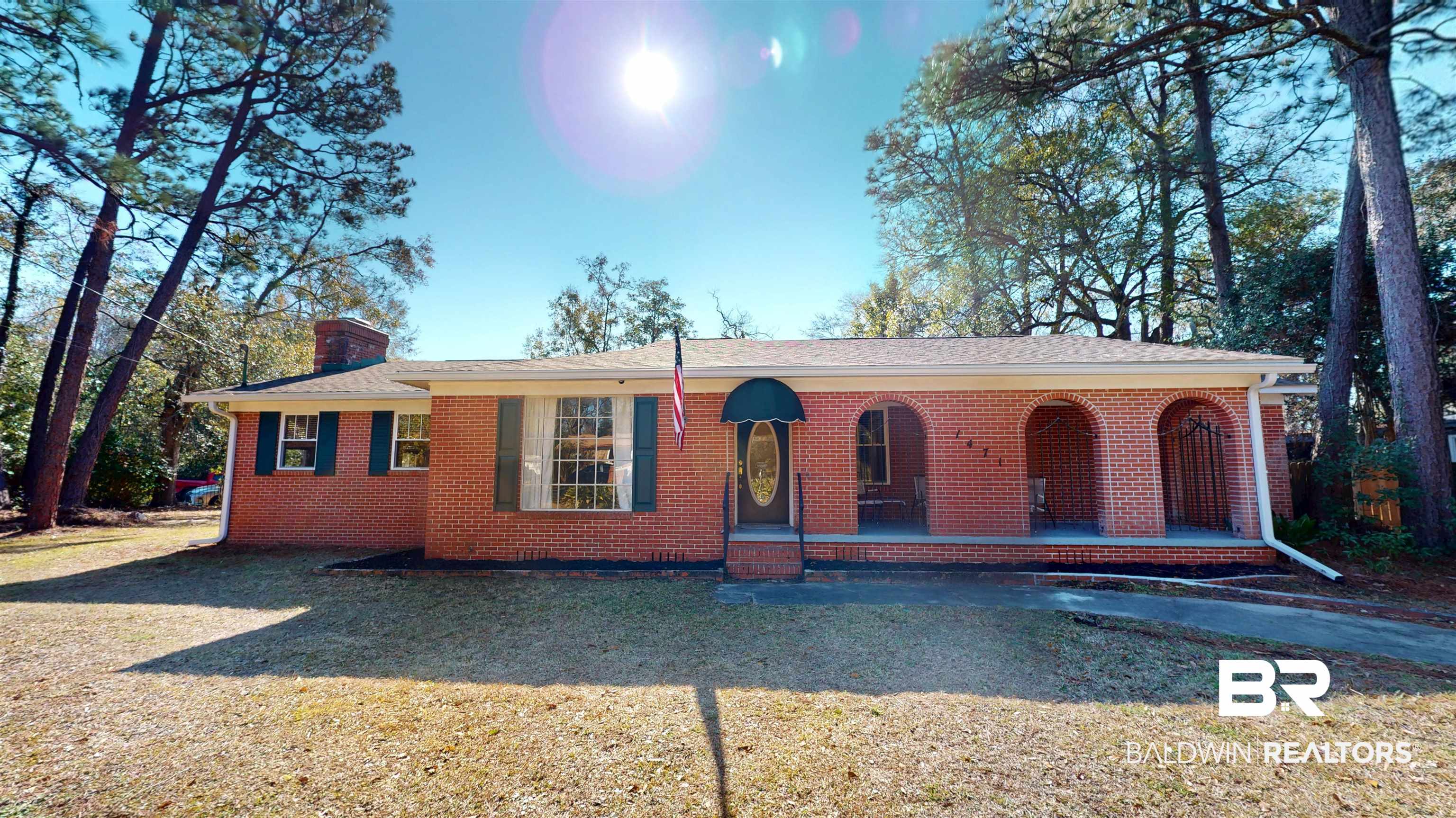 1471 Cedar Crescent Drive Mobile, AL 36605 - Photo 1 of 28 Ranch-style house featuring covered porch, a chimney, a front yard, and brick siding