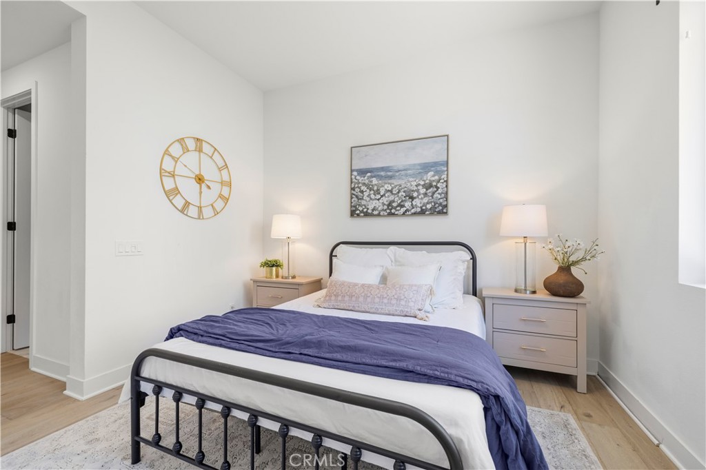 28346 Old Spgs Road Castaic, CA 91384 - Photo 34 of 80 a bedroom with a bed and a chandelier