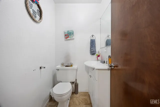 a bathroom with a toilet and a sink