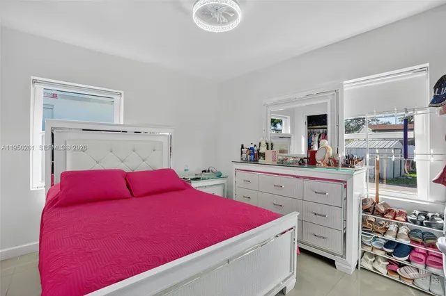 a bed room with a bed and a dresser