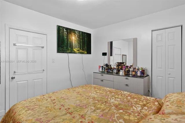 a bedroom with a bed and closet