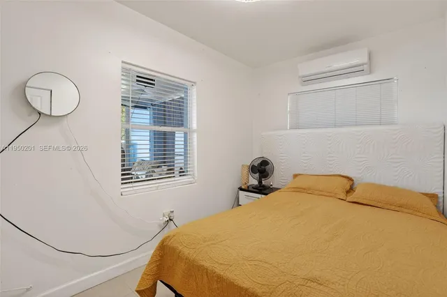 a bedroom with a bed and cabinets