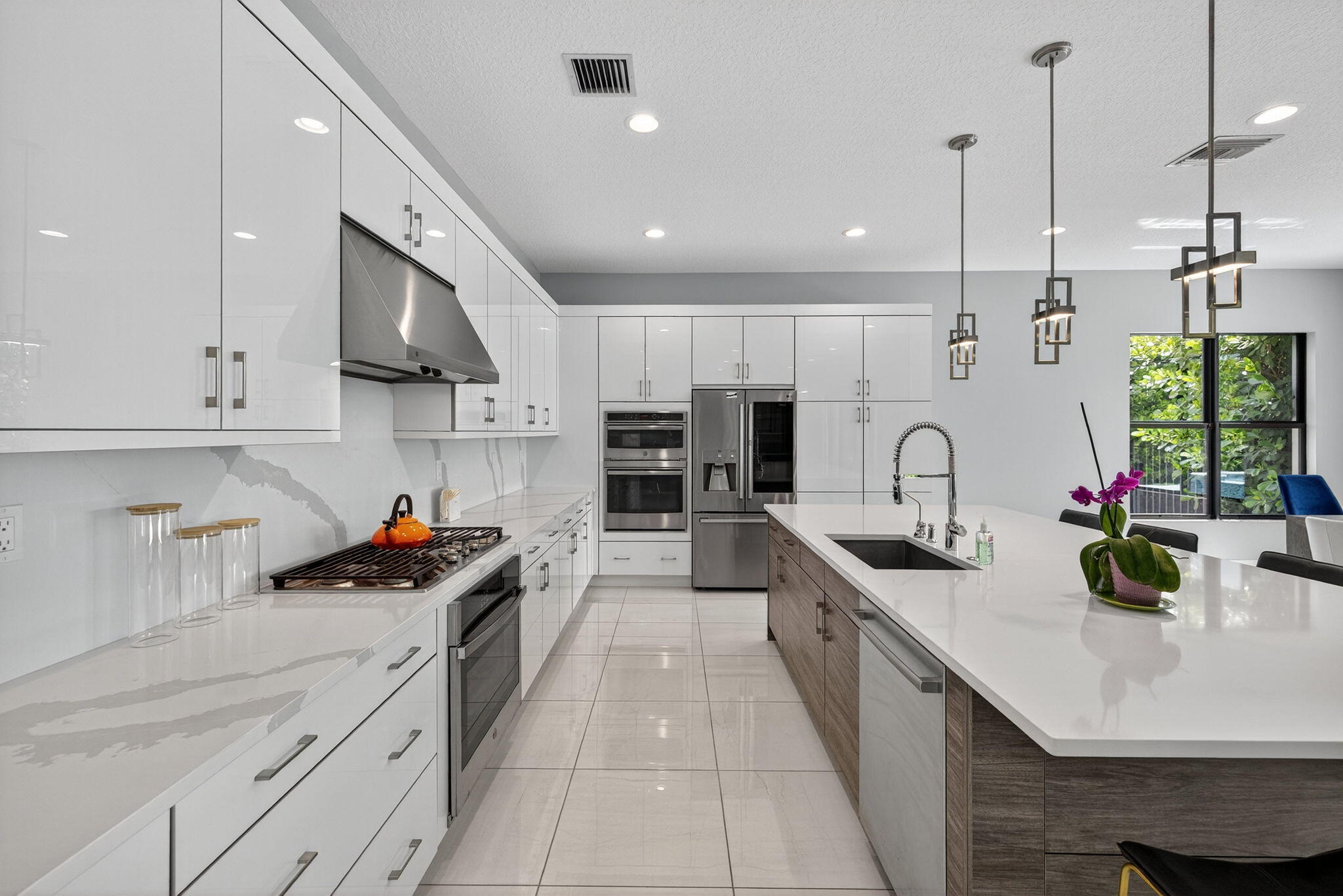 8618 Tower Bridge Court Boca Raton, FL 33496 - Photo 12 of 53 a large kitchen with stainless steel appliances lots of counter space and a sink