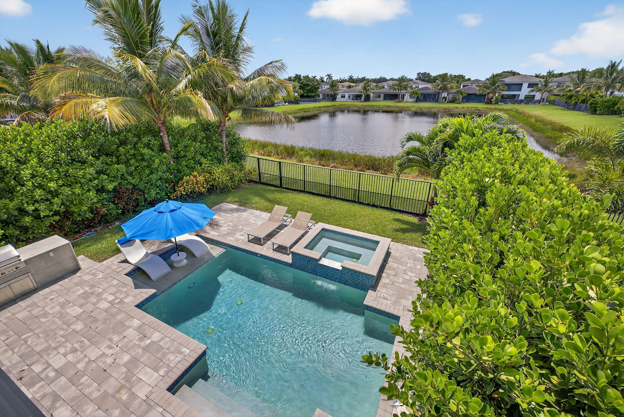 8618 Tower Bridge Court Boca Raton, FL 33496 - Photo 38 of 53 an aerial view of a house with a garden and lake view