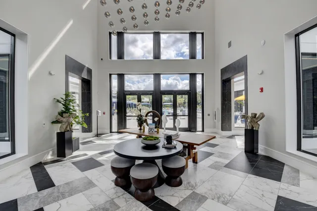 a kitchen with stainless steel appliances granite countertop a stove a sink and a wooden floors
