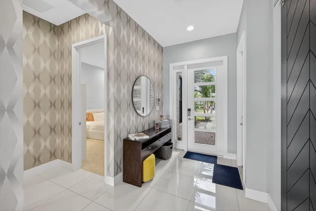 a spacious bedroom with a bed a couch and dresser