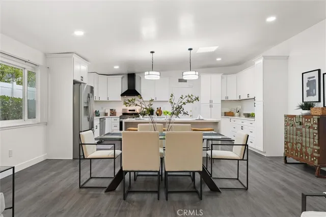 a kitchen with kitchen island wooden cabinets and counter space