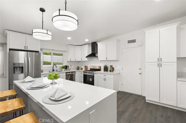 a kitchen with a table and chairs in it