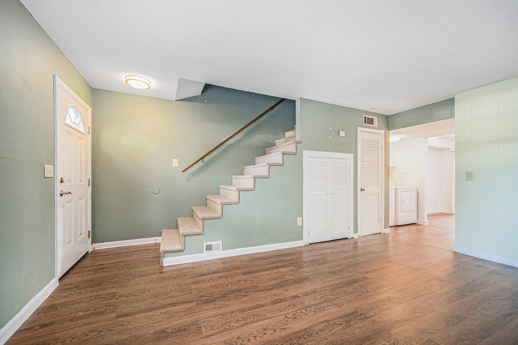 21 Rivers Point Row, Unit 8C Charleston, SC 29412 - Photo 6 of 24 Living Room and Staircase