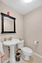 a view of kitchen with refrigerator and window